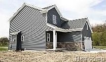 covered porch with stonework trim