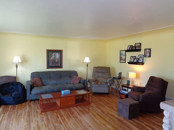 Nice size living room with refinished wood floor.