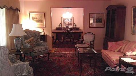 When you enter the home, your guests could be seated in the formal living room on the left.
