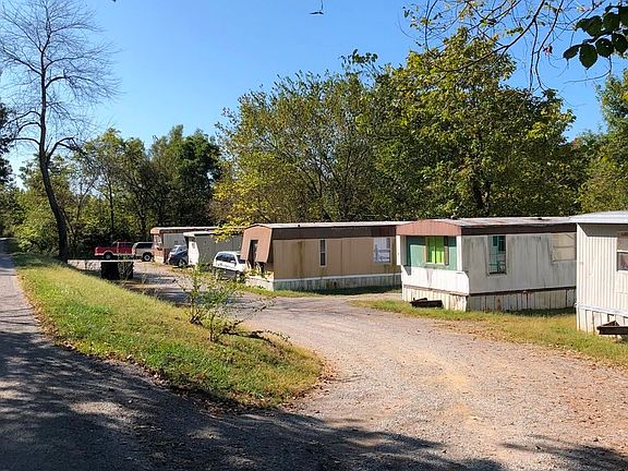 Street view of the MHP.  POH's are in decent shape and are habitable for new renters.