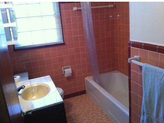 Very clean bathroom with closet.