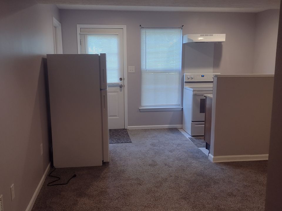 Part of living room and kitchen area