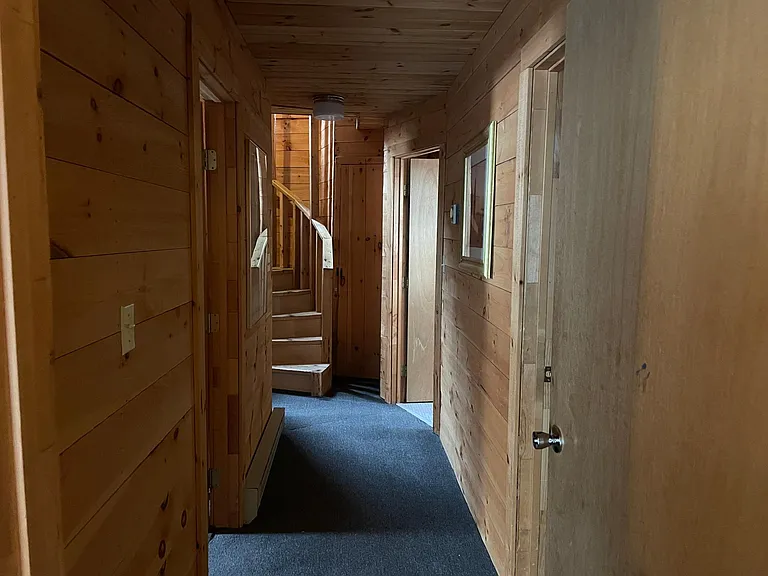 hallway between bedrooms, bath and laundry