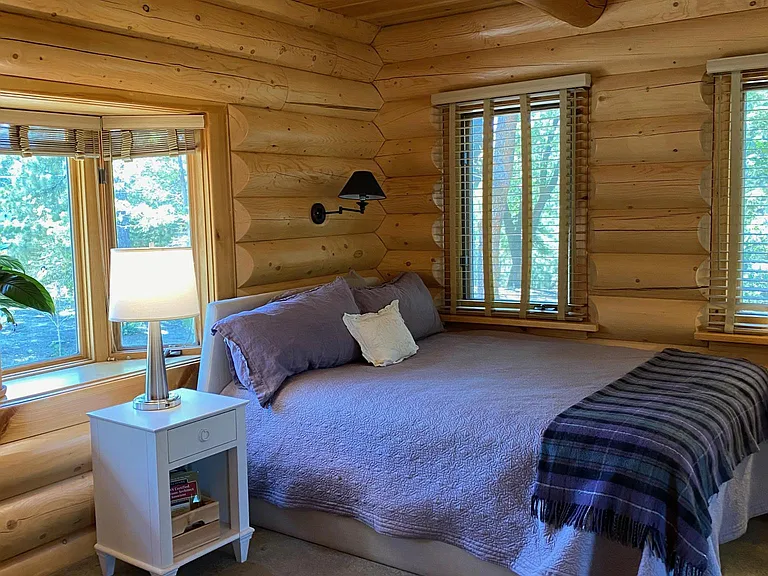 Bedroom 2 with log walls