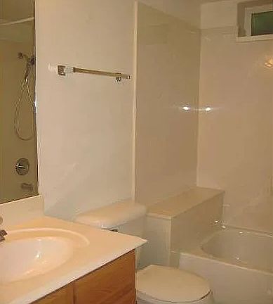 Bathroom featuring vanity and tub / shower combination