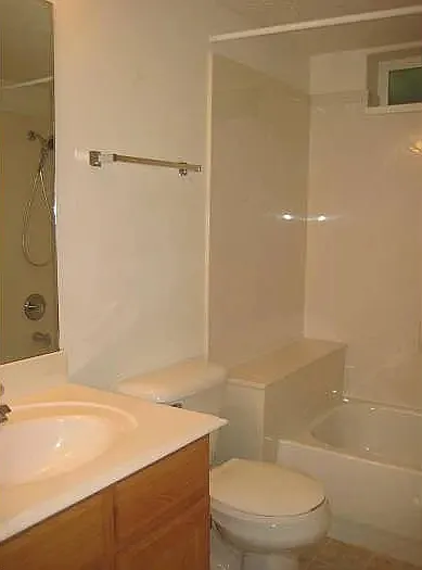 Bathroom featuring vanity and tub / shower combination