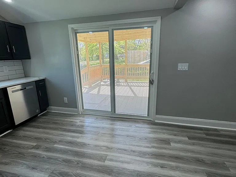Sliding glass door opens to new deck