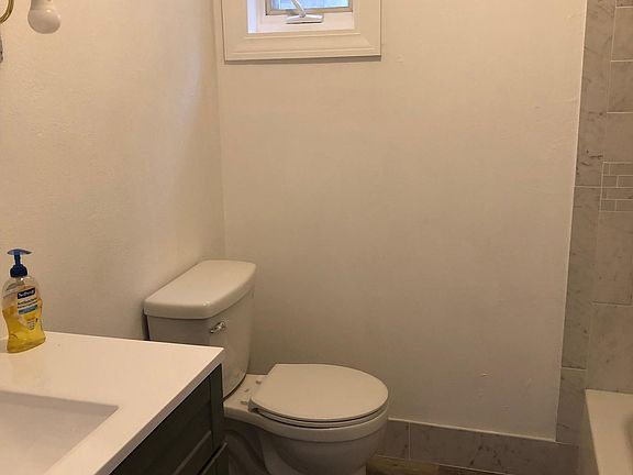 Renovated bath. Full bathtub with shower not shown.