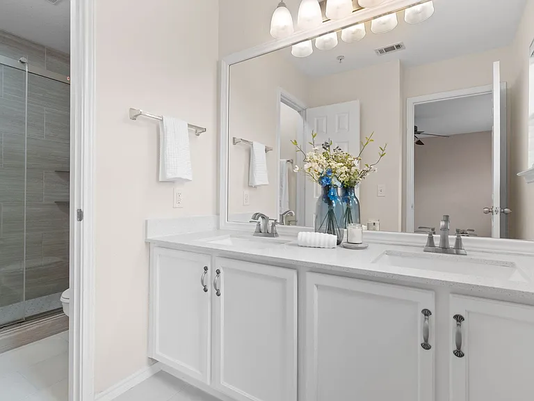 Primary Bathroom with new quartz countertops installed, new Tile Floor, freshly painted and new light fixture all in 2026.