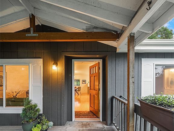 The covered entry porch has plenty of room for table and chairs for outdoor enjoyment.