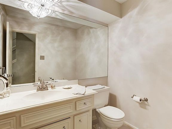 The half bath is located downstairs and is convenient for you and your guests.  The vanity is cultured marble with an updated faucet.
