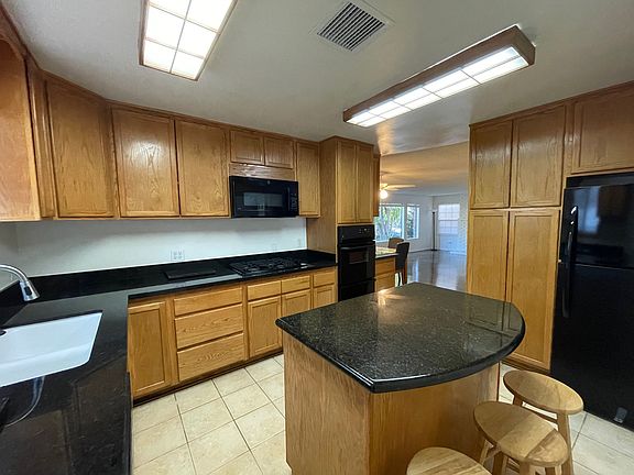 Kitchen with Dining Room and Living Room in Background