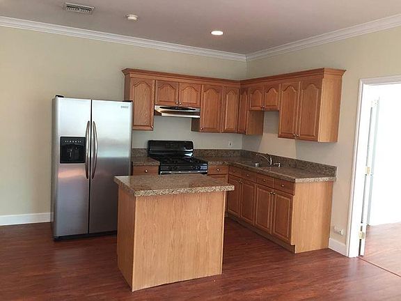 Kitchen with refrigerator.