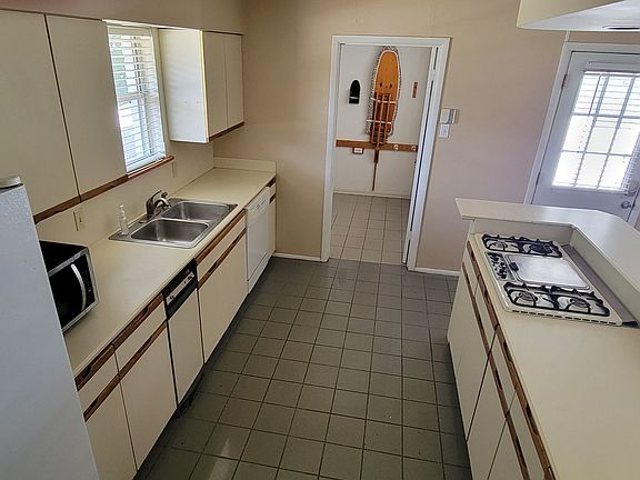 Kitchen with Laundry Room / Pantry in the background