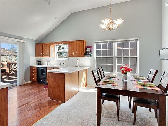 The Kitchen boasts hardwood floors and a spacious Dining Area.