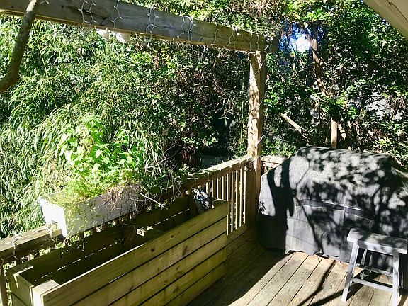 Upper Deck off DR Faces Backyard with Herb Garden Bed & Space for a Grill