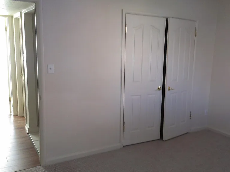 Hallway off Bedroom. Storage 1st alcove on right. Your own entry to the laundry room is the door you see next in the hallway, also to the right. It is dead bolted for your security. The outer door to the laundry room is also dead bolted. An enforced