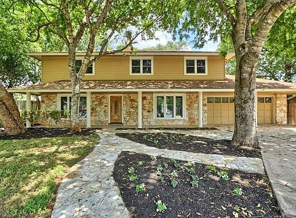 Beautiful trees shade the front porch