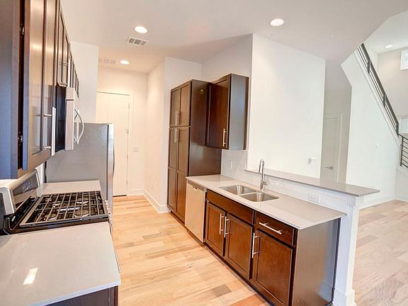 Kitchen with laundry room doors closed at rear