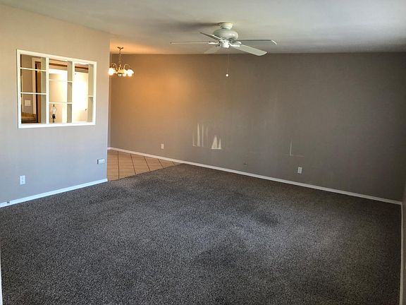 LR 250 sq.ft. and dinette, Now New plank flooring in LR & BR's
Sunlight is shining on wall.