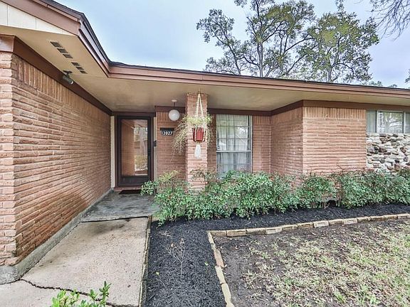 covered entry and a glass screen door