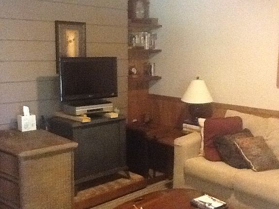 Basement, wrap around couch,