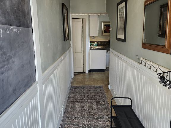 Private entrance with a place to hang your coat and a shelf for shoes