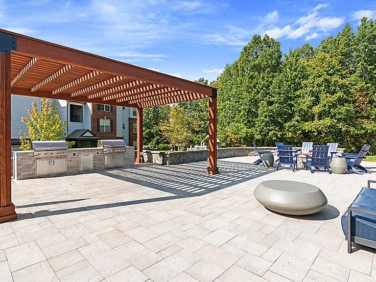 Outdoor BBQ lounge with gas grills and fire pit