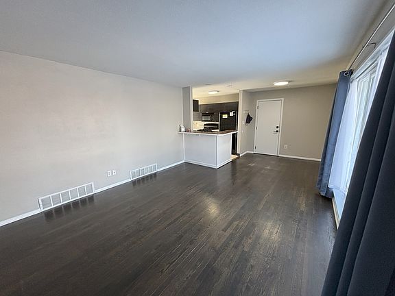 view from main entry door looking into living and dining room