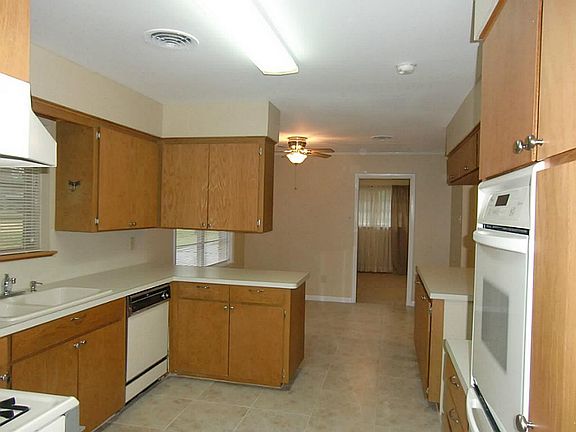 Another view of large working kitchen with breakfast area.