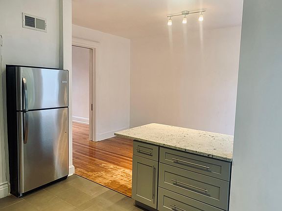 The new kitchen flows into the dining room.