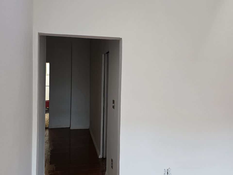 Hallway to other rooms from living room.