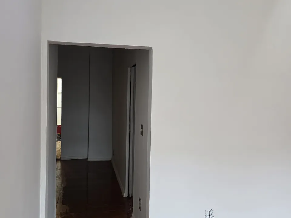 Hallway to other rooms from living room.