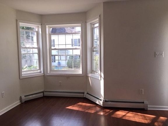 Living room with sunny bay window.