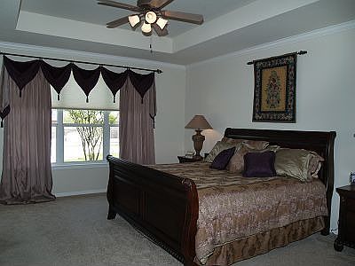 Master on main level with step ceilings and large windows.