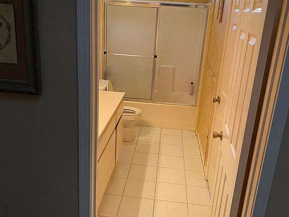 A view of the 2nd bathroom from the hallway. And, door also opens up to the bedroom.