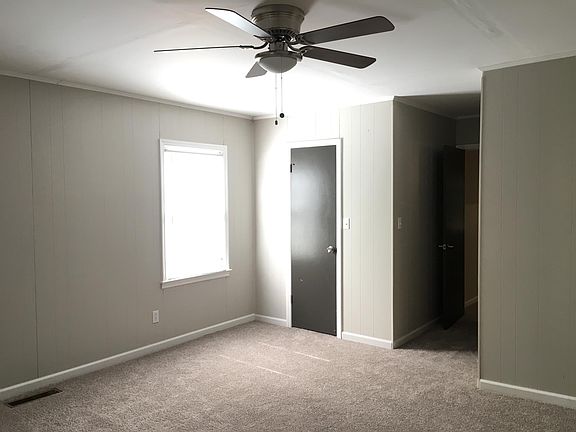 Master bedroom with private bathroom and walk-in closet.