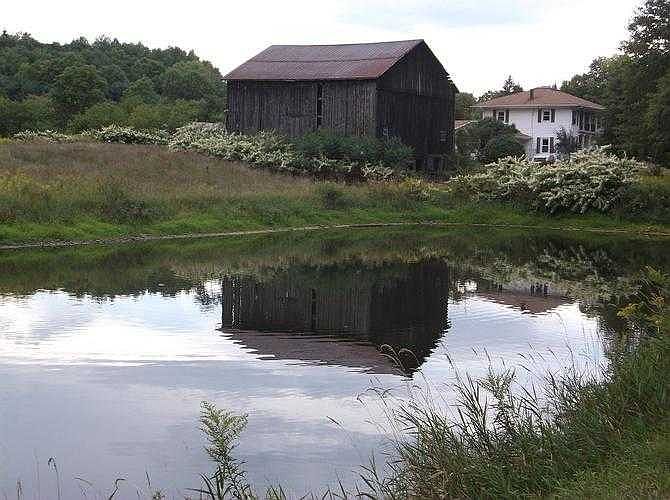 House & Barn reflecting in poond