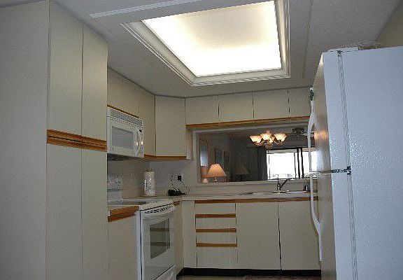 Kitchen with Tray Ceiling, Tile Floors