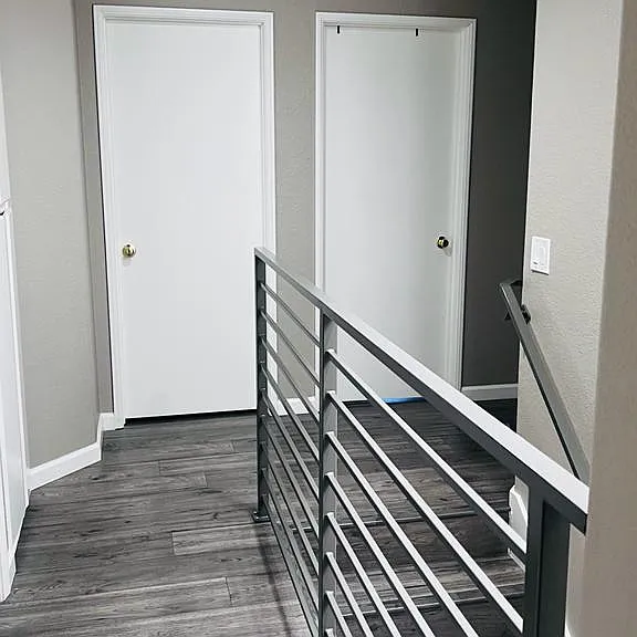 Upstairs Hallway - Bedroom #2 on the left and Bedroom #3 on the right and Washer & Dryer upstairs and full guest bathroom