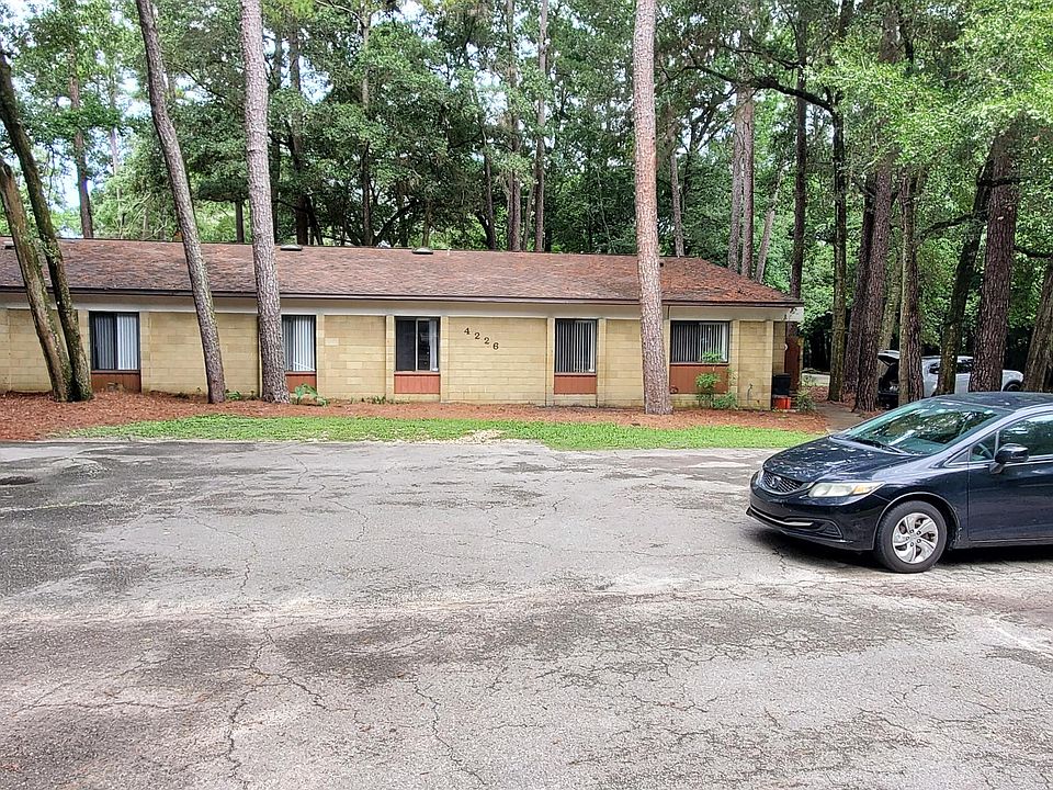 Front of building. Apartment D is on the front right. Total of 8 parking spaces for the building.