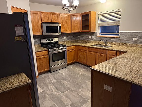 Kitchen with new tile floor, and backsplashes