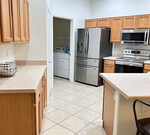 kitchen with pantry and stainless appliances