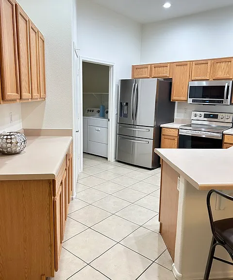 kitchen with pantry and stainless appliances
