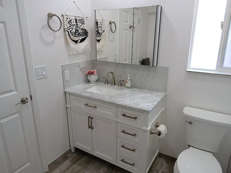 Marble Vanity with tons of stoarage, including a light up medicine cabinet