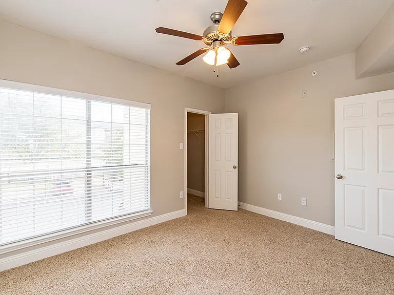 Comfortable bedroom with natural light and neutral tones