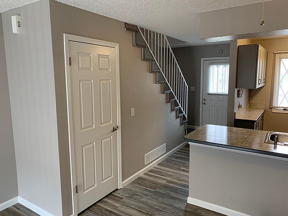 Coat closet and stairs to 2nd level