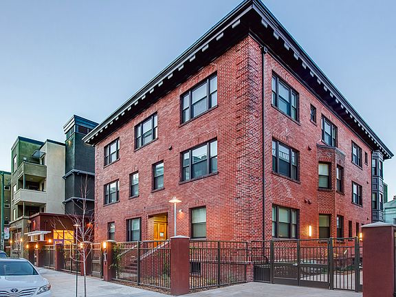 Classic brick charm meets modern urban living in a vibrant neighborhood setting.