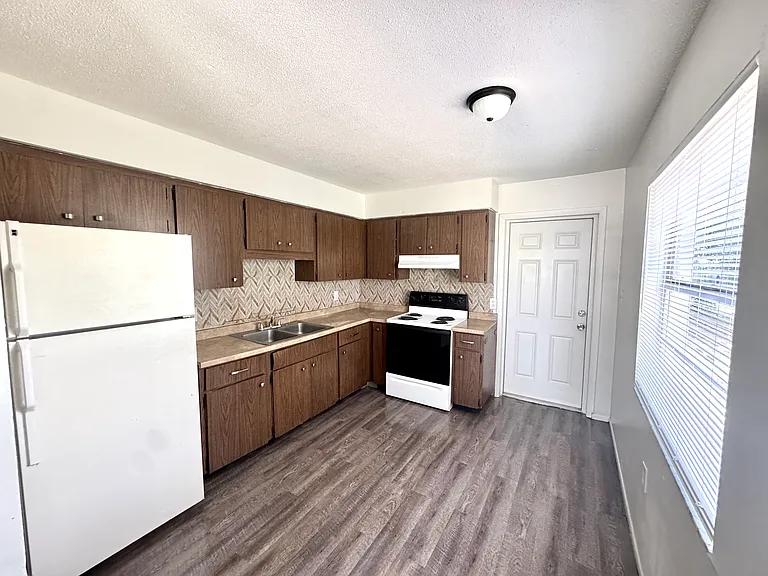 Interior photos are of a neighboring unit with identical floor plan. Paint color is the same, but the flooring is actually ceramic tile.
