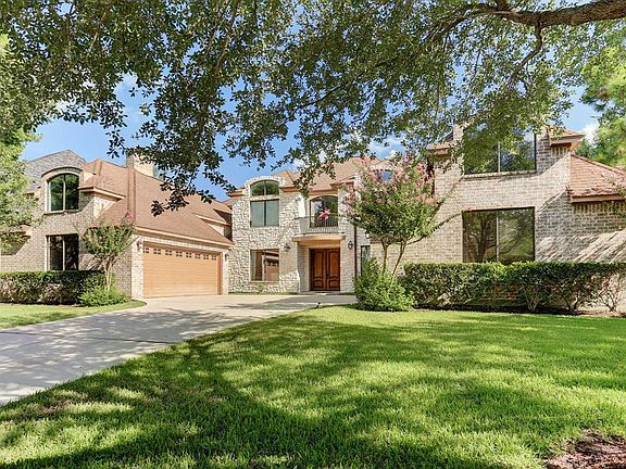 Lush landscaping with mature trees provides great curb appeal.